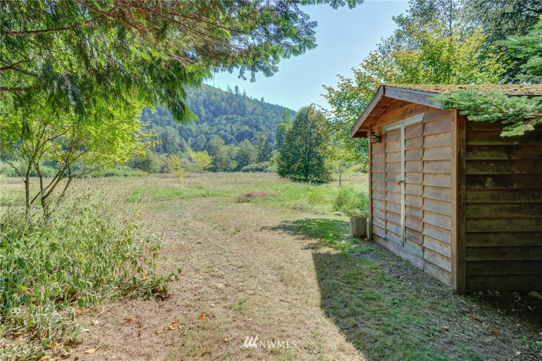 7565 Bear Ridge Way Maple Falls, WA 98266 - Photo 21 of 25 a backyard of a house with lots of green space