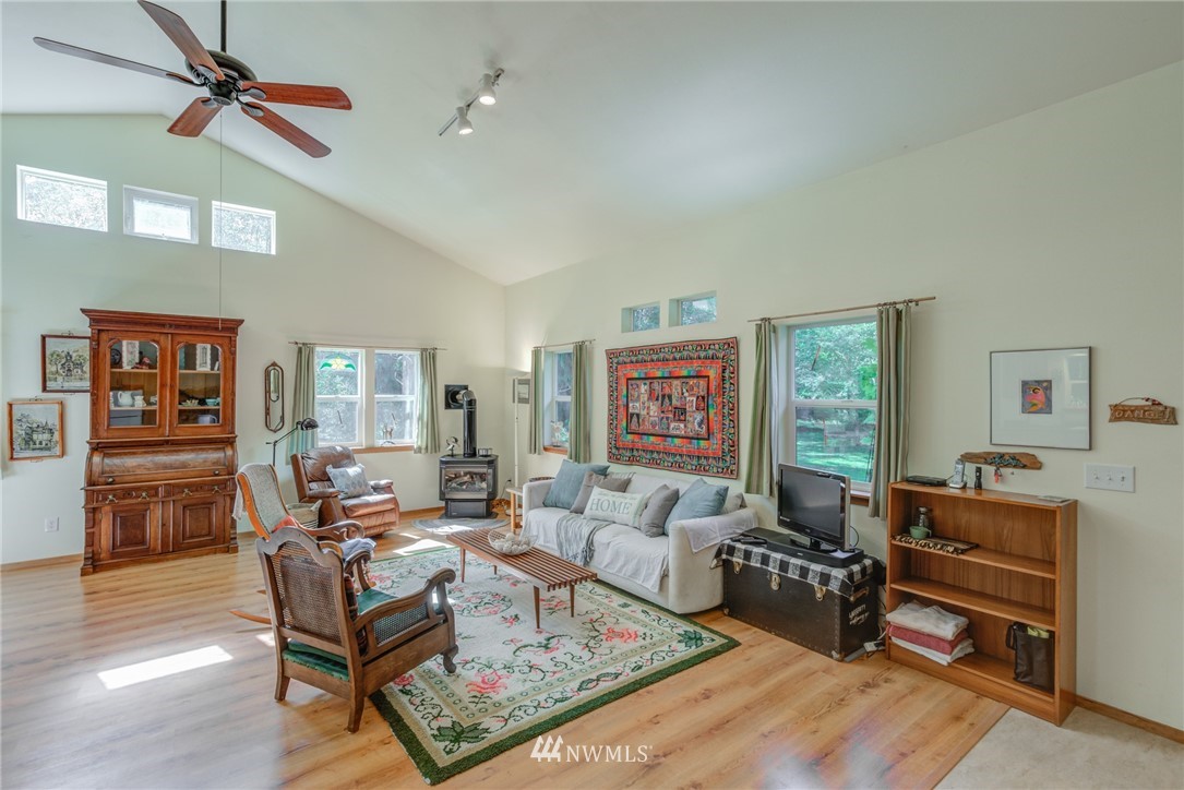 7565 Bear Ridge Way Maple Falls, WA 98266 - Photo 7 of 25 a living room with furniture a ceiling fan and a window