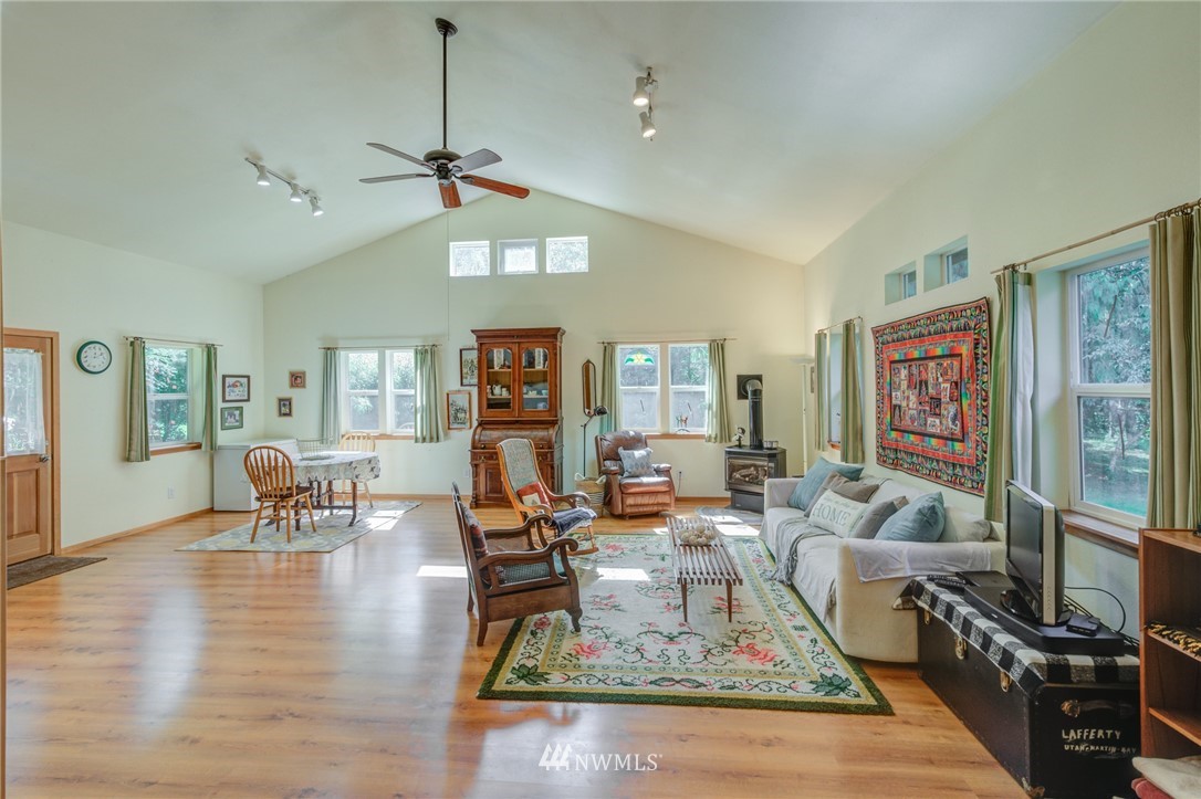 7565 Bear Ridge Way Maple Falls, WA 98266 - Photo 8 of 25 a living room with furniture large window and wooden floor