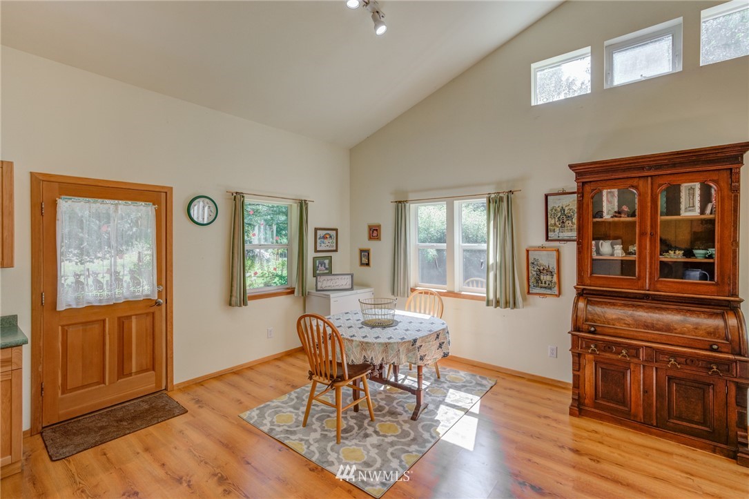 7565 Bear Ridge Way Maple Falls, WA 98266 - Photo 10 of 25 a dining room with furniture a window and wooden floor