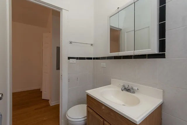 a bathroom with a sink toilet and vanity