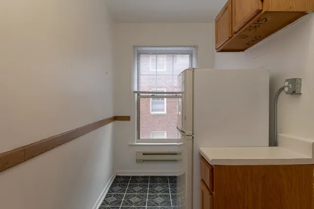 a bathroom with a window sink and vanity