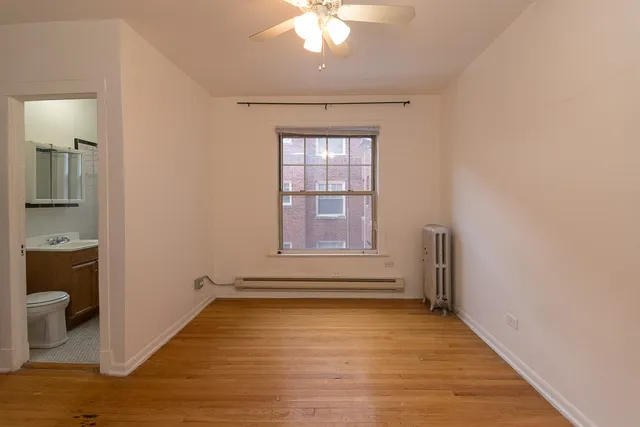 a view of an empty room with a window