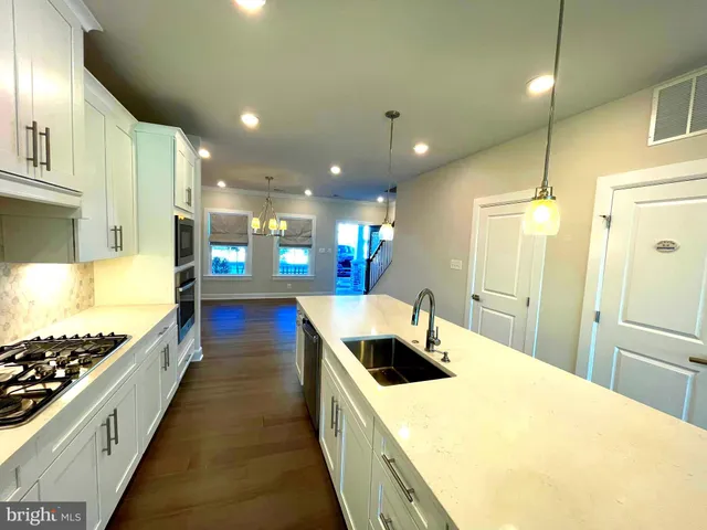 a view of hallway with wooden floor