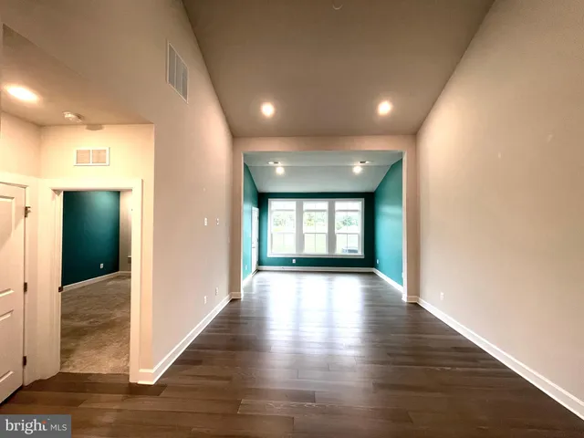 a bathroom with a double vanity sink and mirror