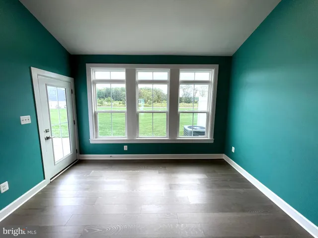 a bathroom with a double vanity sink mirror and toilet