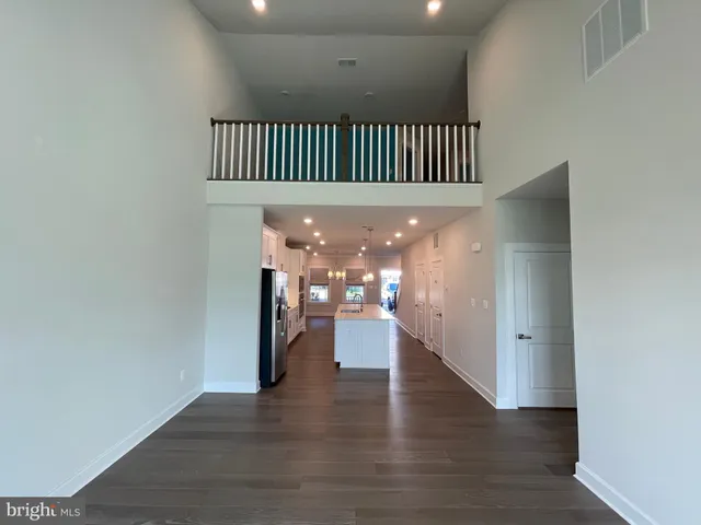 a bathroom with a sink a toilet a mirror and vanity