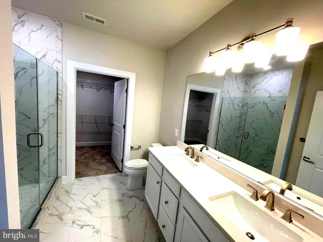 a view of a chairs and table in the balcony