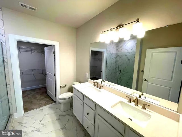 a view of a porch with a table and chairs