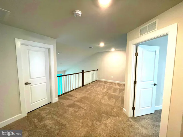 an aerial view of a house with a big yard