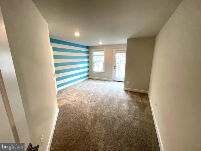 a view of yard with swimming pool and green space