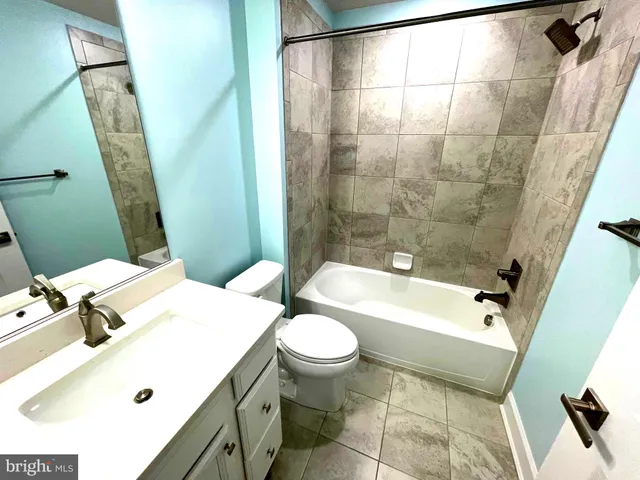 a view of a room with gym equipment and a large window