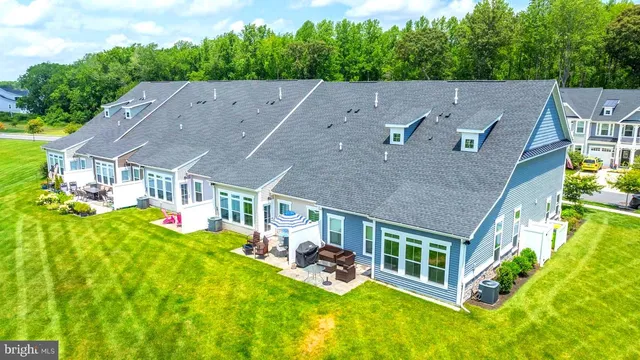 a view of a swimming pool with a yard