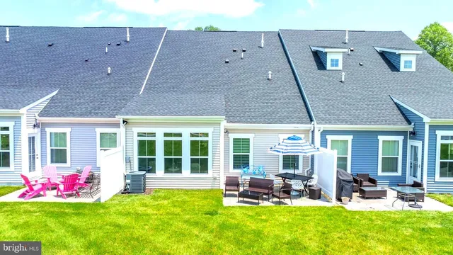 an aerial view of houses with yard