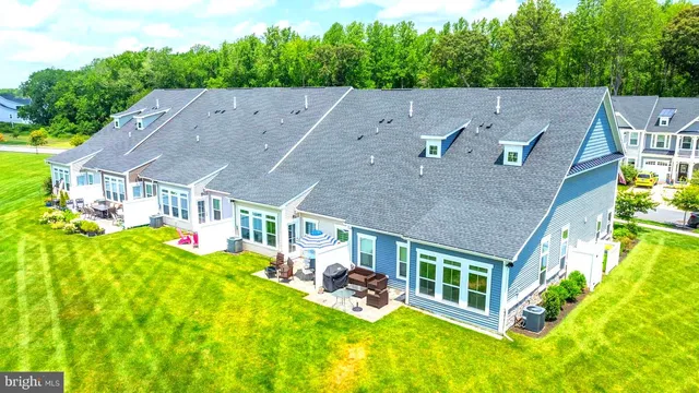 a view of a lake with houses in the back