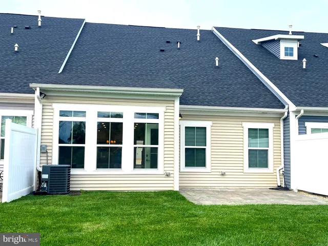 a view of a swimming pool with a lounge chair
