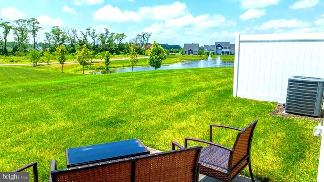 a view of a patio with chairs and a table