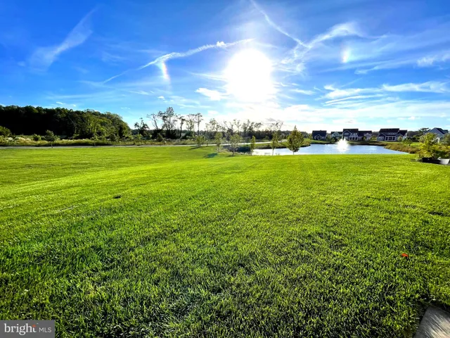 a view of a patio with swimming pool and furniture