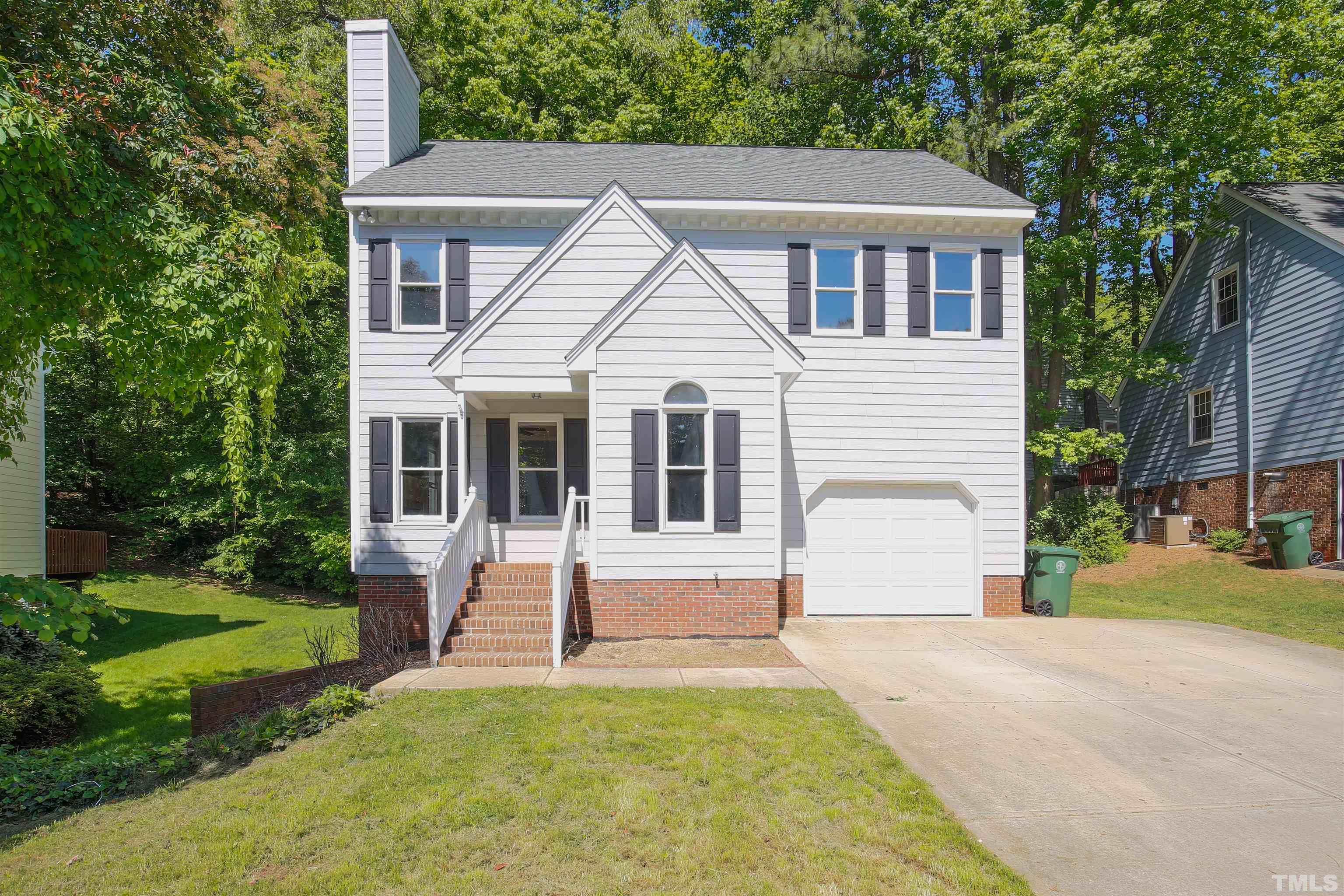 115 Kingsmill Road Cary, NC 27511 - Photo 1 of 19 a view of house with backyard and garden