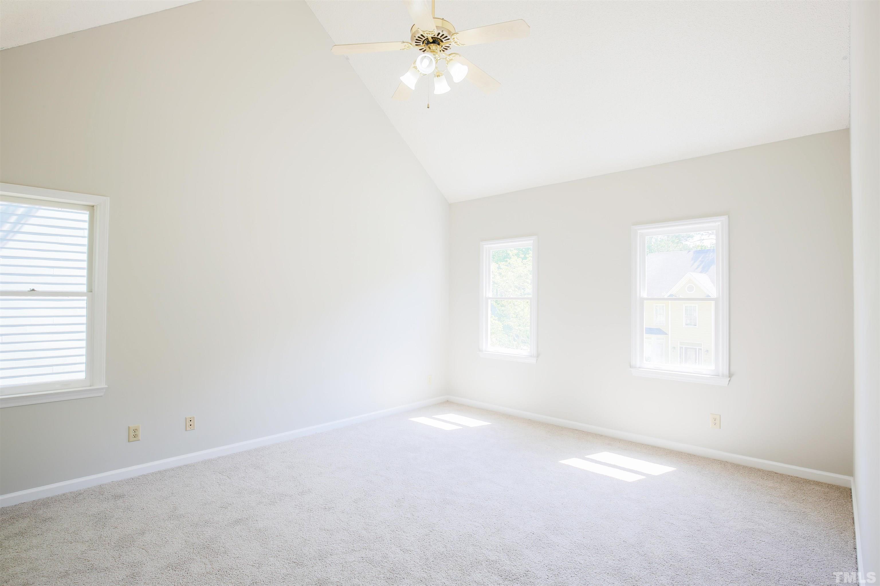 115 Kingsmill Road Cary, NC 27511 - Photo 11 of 19 an empty room with a window and a fan