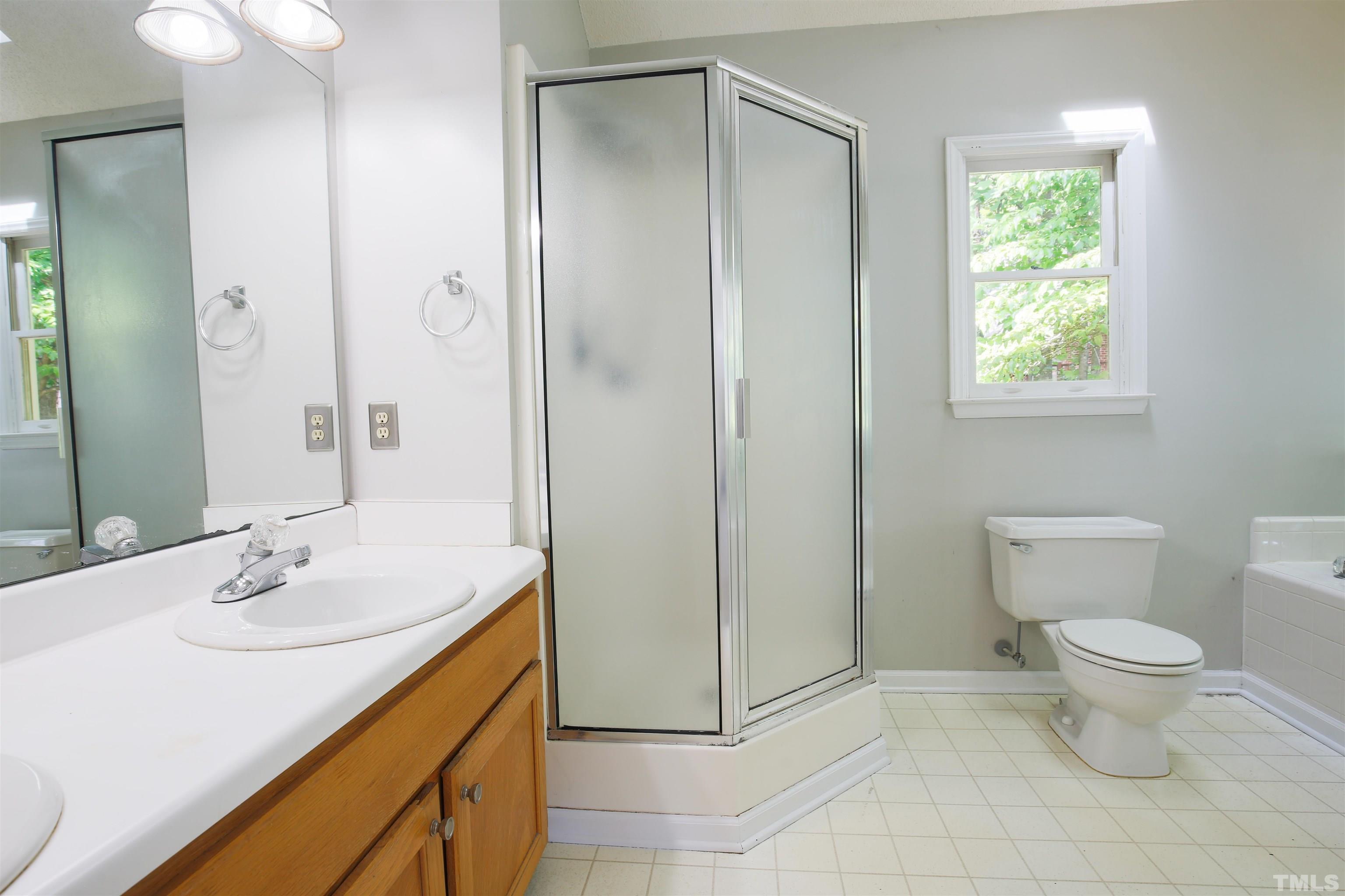 115 Kingsmill Road Cary, NC 27511 - Photo 12 of 19 a bathroom with a sink toilet and shower