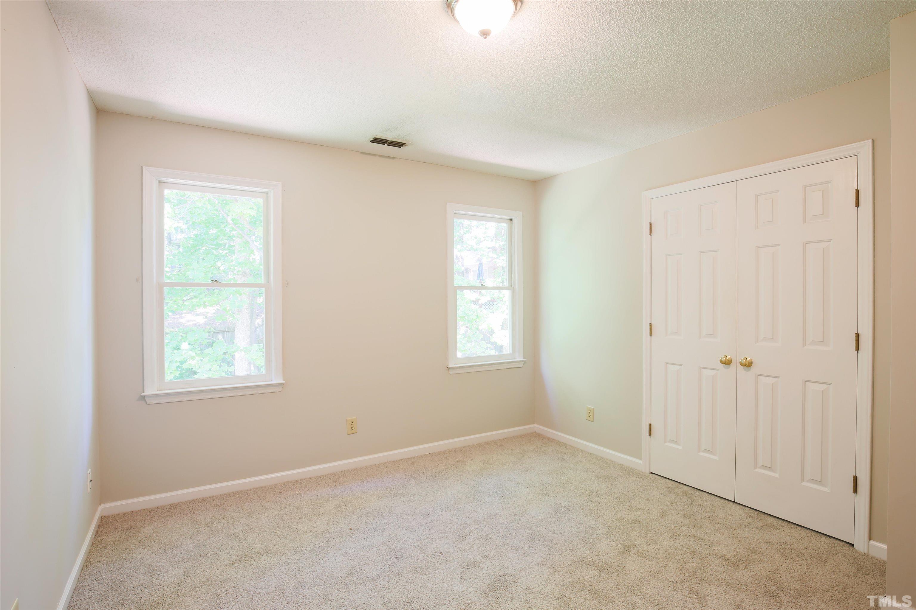 115 Kingsmill Road Cary, NC 27511 - Photo 13 of 19 an empty room with windows
