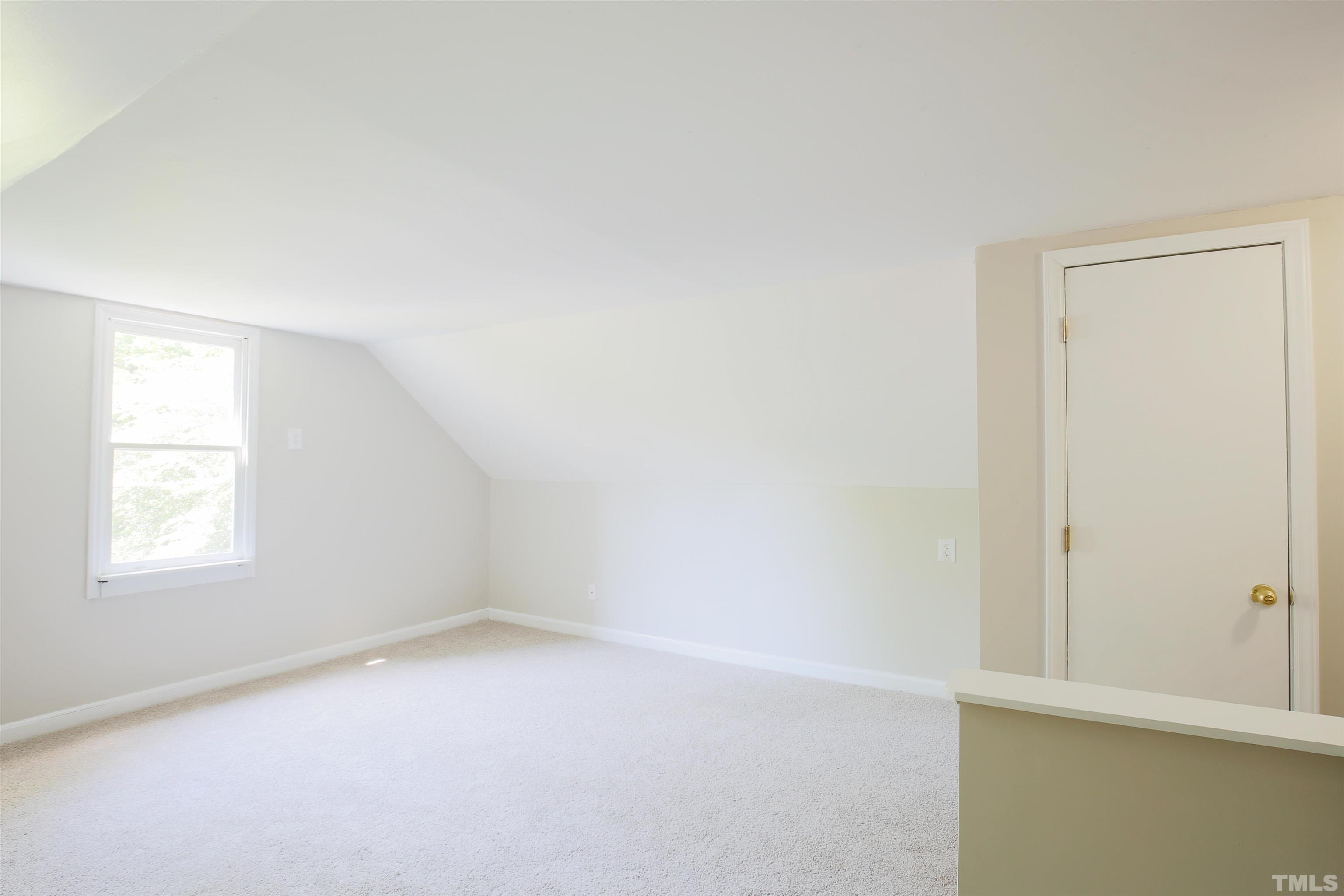 115 Kingsmill Road Cary, NC 27511 - Photo 14 of 19 an empty room with a window