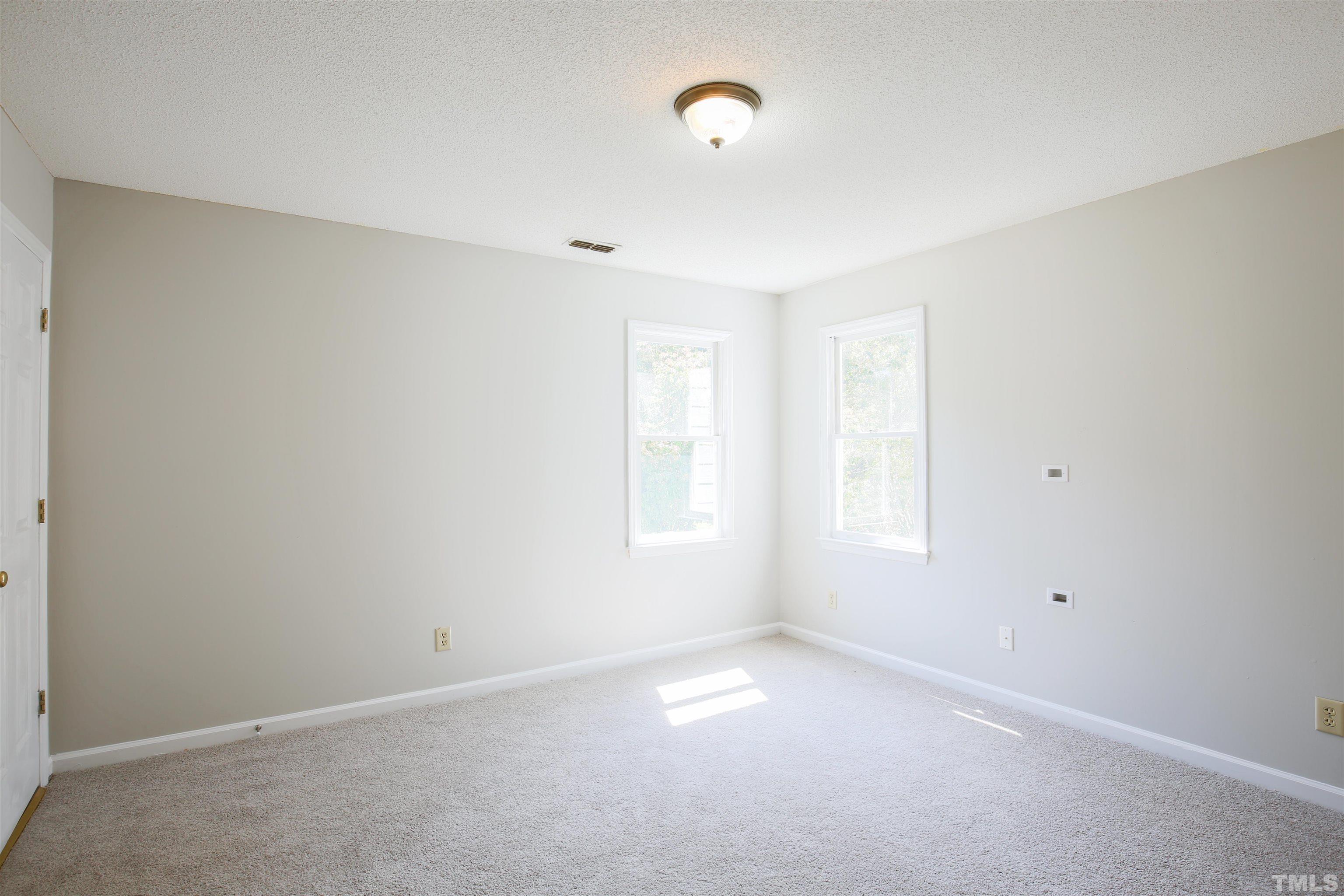 115 Kingsmill Road Cary, NC 27511 - Photo 15 of 19 an empty room with a window