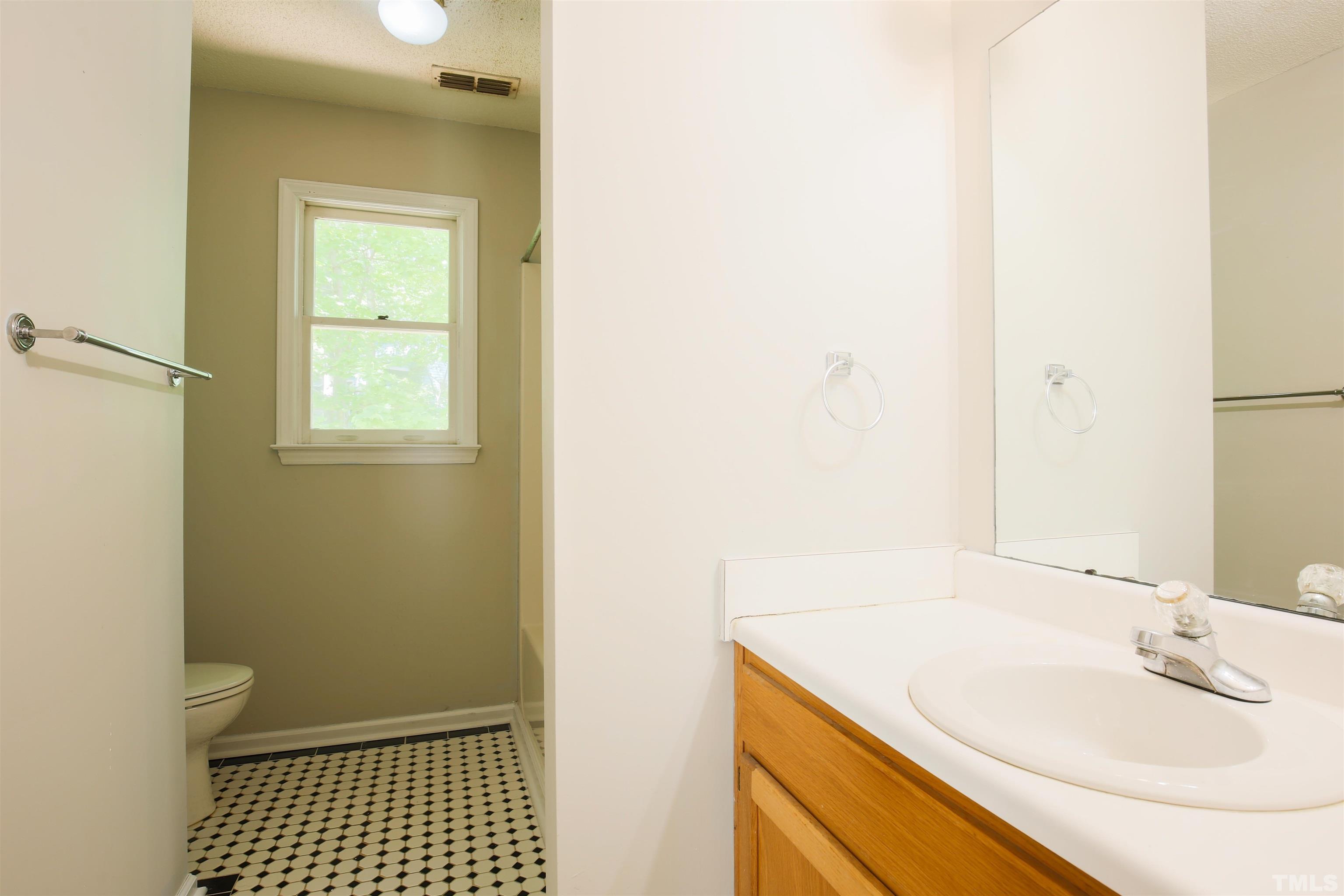 115 Kingsmill Road Cary, NC 27511 - Photo 17 of 19 a bathroom with a sink and a mirror