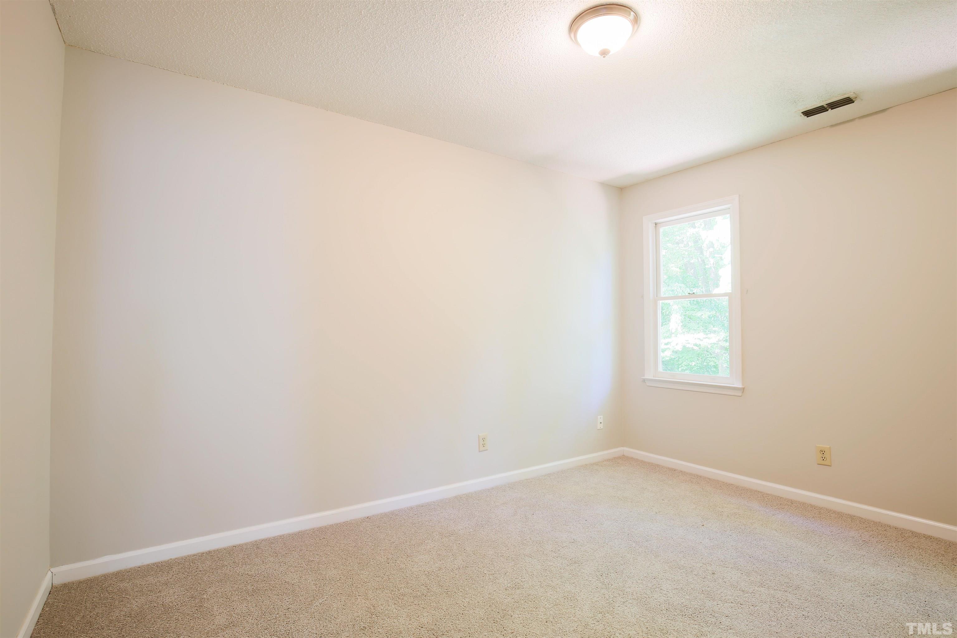 115 Kingsmill Road Cary, NC 27511 - Photo 6 of 19 an empty room with windows