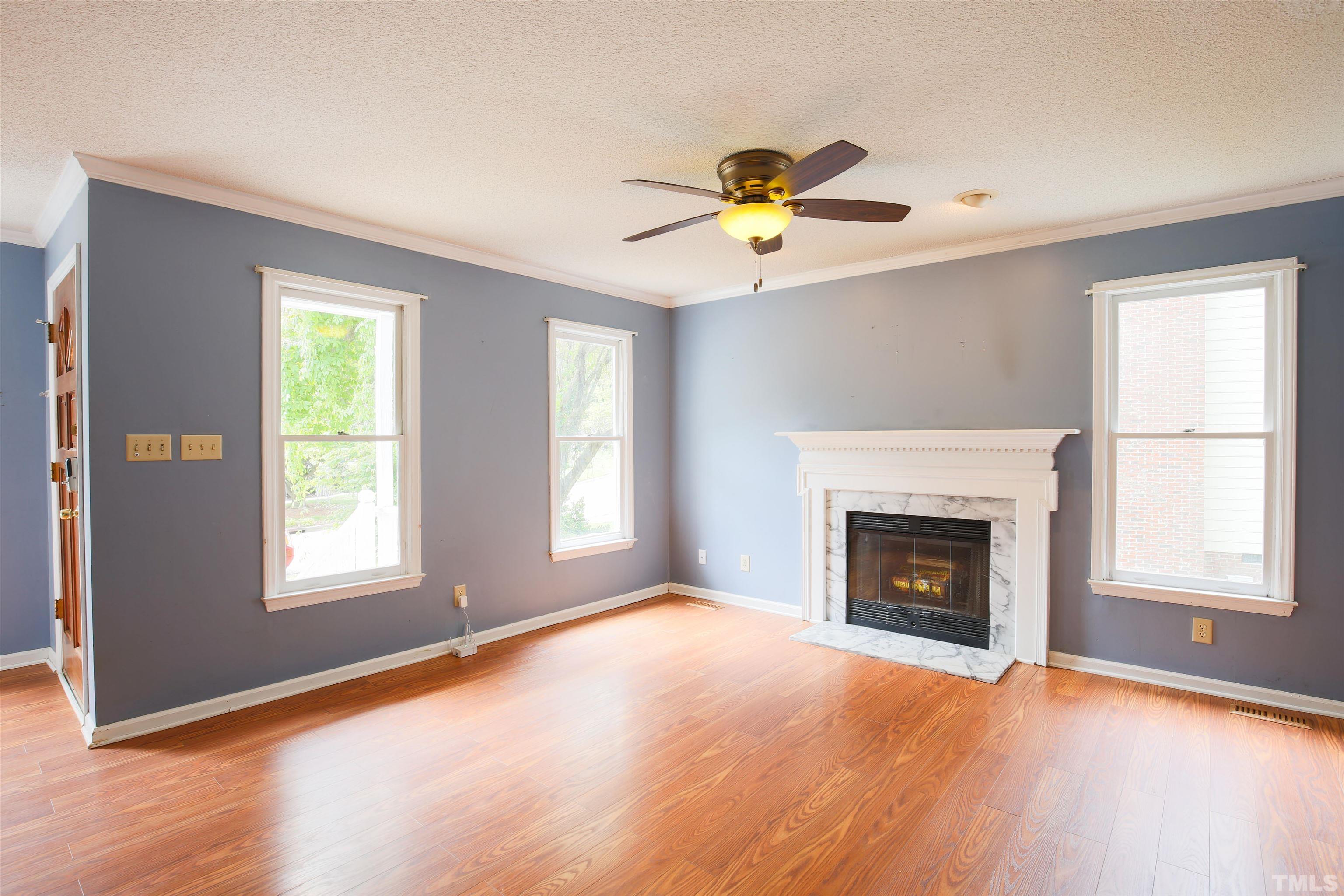 115 Kingsmill Road Cary, NC 27511 - Photo 9 of 19 a view of an empty room with window and fire place