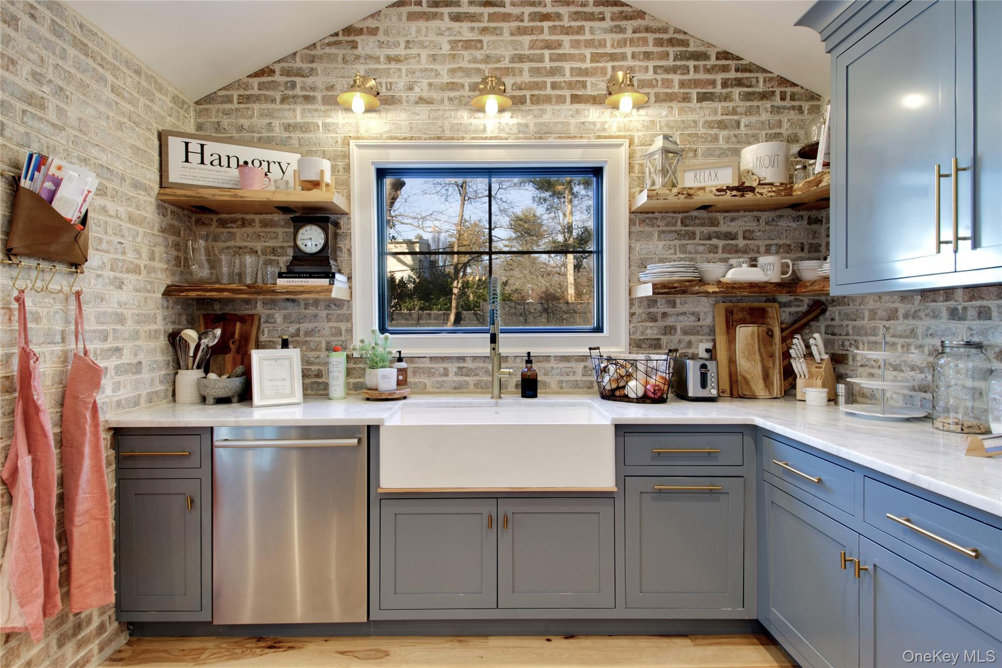 97 Bar Beach Road Port Washington, NY 11050 - Photo 12 of 28 a kitchen with a sink and cabinets