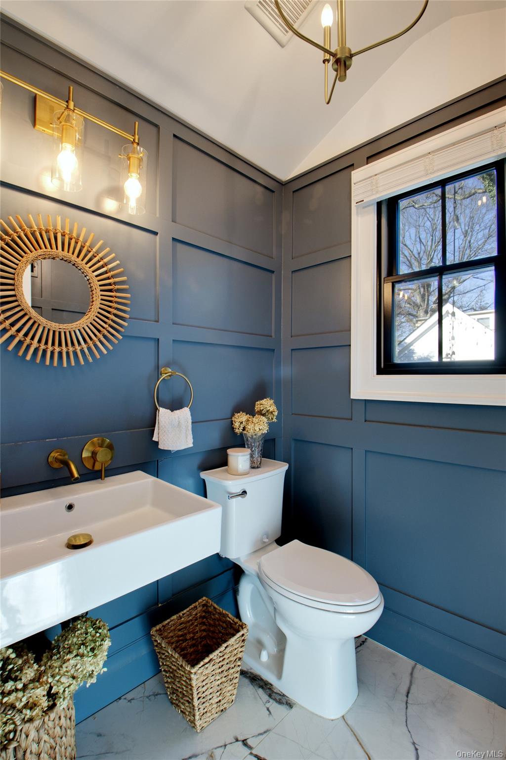 97 Bar Beach Road Port Washington, NY 11050 - Photo 16 of 28 a bathroom with a toilet a sink and mirror