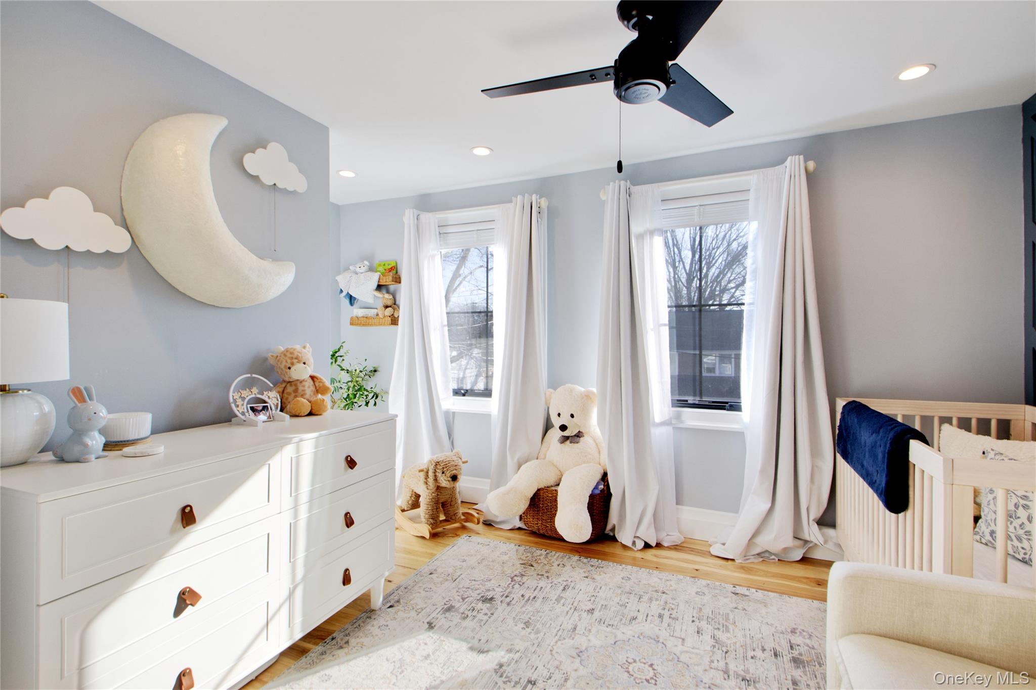 97 Bar Beach Road Port Washington, NY 11050 - Photo 22 of 28 a bedroom with furniture and a window