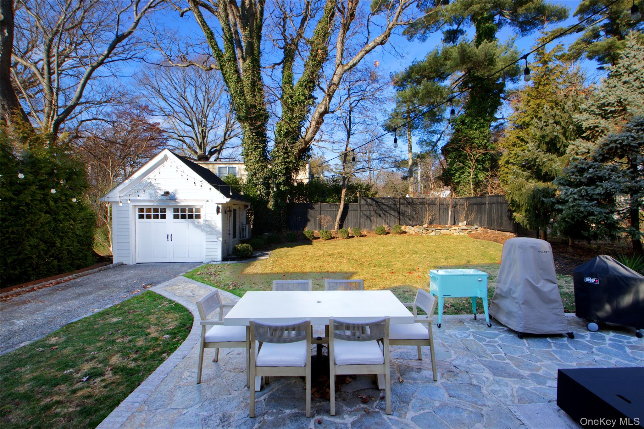 97 Bar Beach Road Port Washington, NY 11050 - Photo 27 of 28 a view of a house with backyard and sitting area