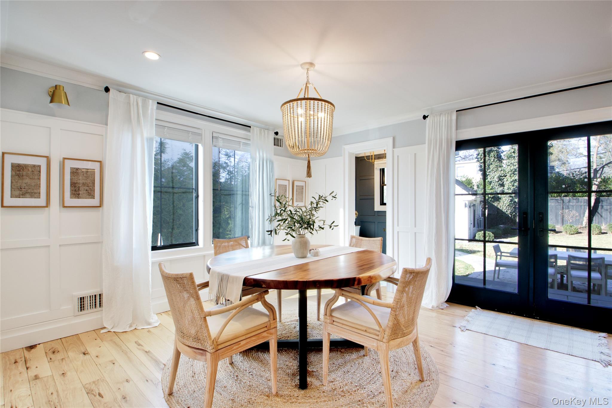 97 Bar Beach Road Port Washington, NY 11050 - Photo 8 of 28 a view of a dining room with furniture and wooden floor