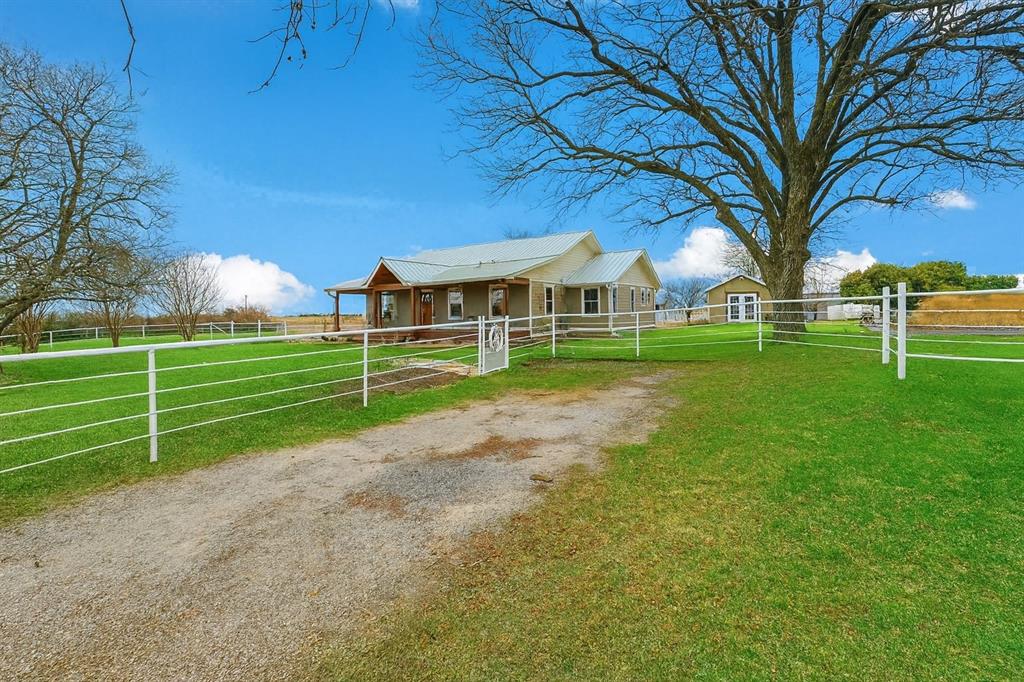 2196 Bledsoe Road Gunter, TX 75058 - Photo 27 of 33 a view of a house with a big yard