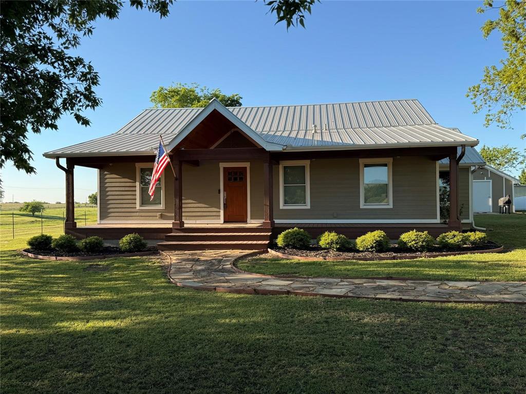 2196 Bledsoe Road Gunter, TX 75058 - Photo 3 of 33 a front view of a house with a garden