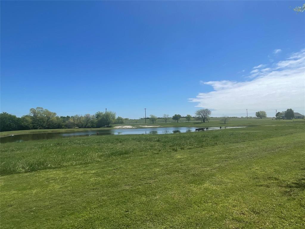 2196 Bledsoe Road Gunter, TX 75058 - Photo 32 of 33 a view of a lake with houses in the background