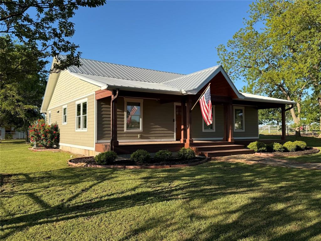 2196 Bledsoe Road Gunter, TX 75058 - Photo 4 of 33 a front view of a house with a garden