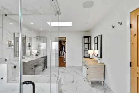 a bedroom with a large bed and a large window