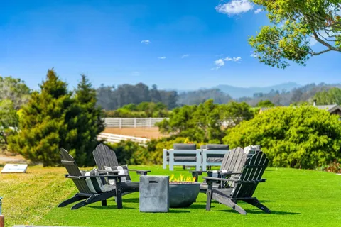 a view of a swimming pool with a yard