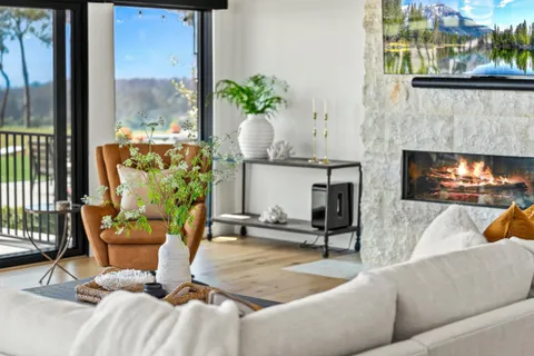 a view of living room with furniture and a window