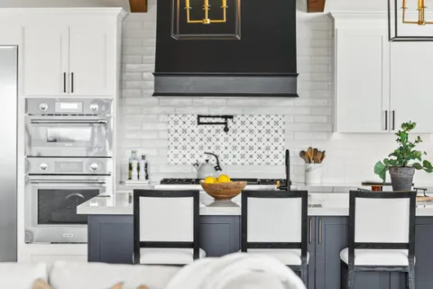 a dinning table and chairs in a kitchen