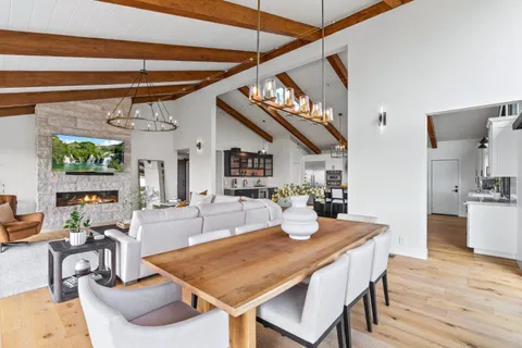 a living room with fireplace furniture and a flat screen tv