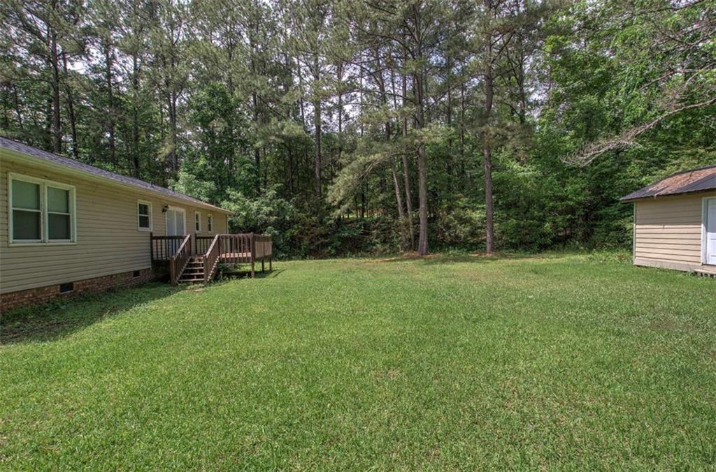 60 Lee Street Rockmart, GA 30153 - Photo 12 of 21 a view of backyard with a barn and large trees