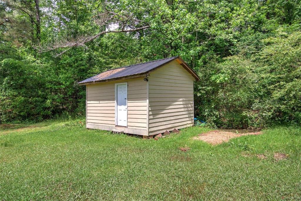 60 Lee Street Rockmart, GA 30153 - Photo 13 of 21 a view of a house with a yard