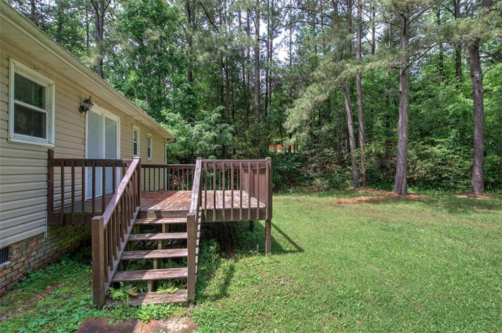 60 Lee Street Rockmart, GA 30153 - Photo 15 of 21 a view of backyard with wooden deck and a large tree