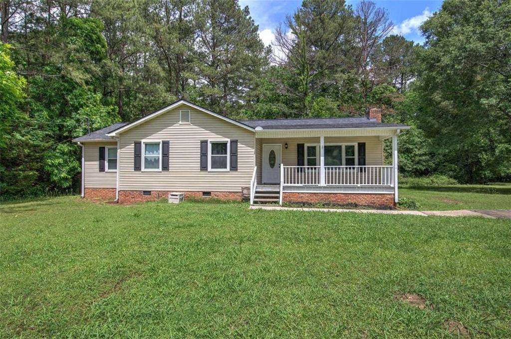 60 Lee Street Rockmart, GA 30153 - Photo 17 of 21 a front view of a house with a garden