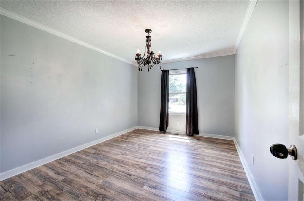 60 Lee Street Rockmart, GA 30153 - Photo 6 of 21 a view of a chandelier in big room and wooden floor